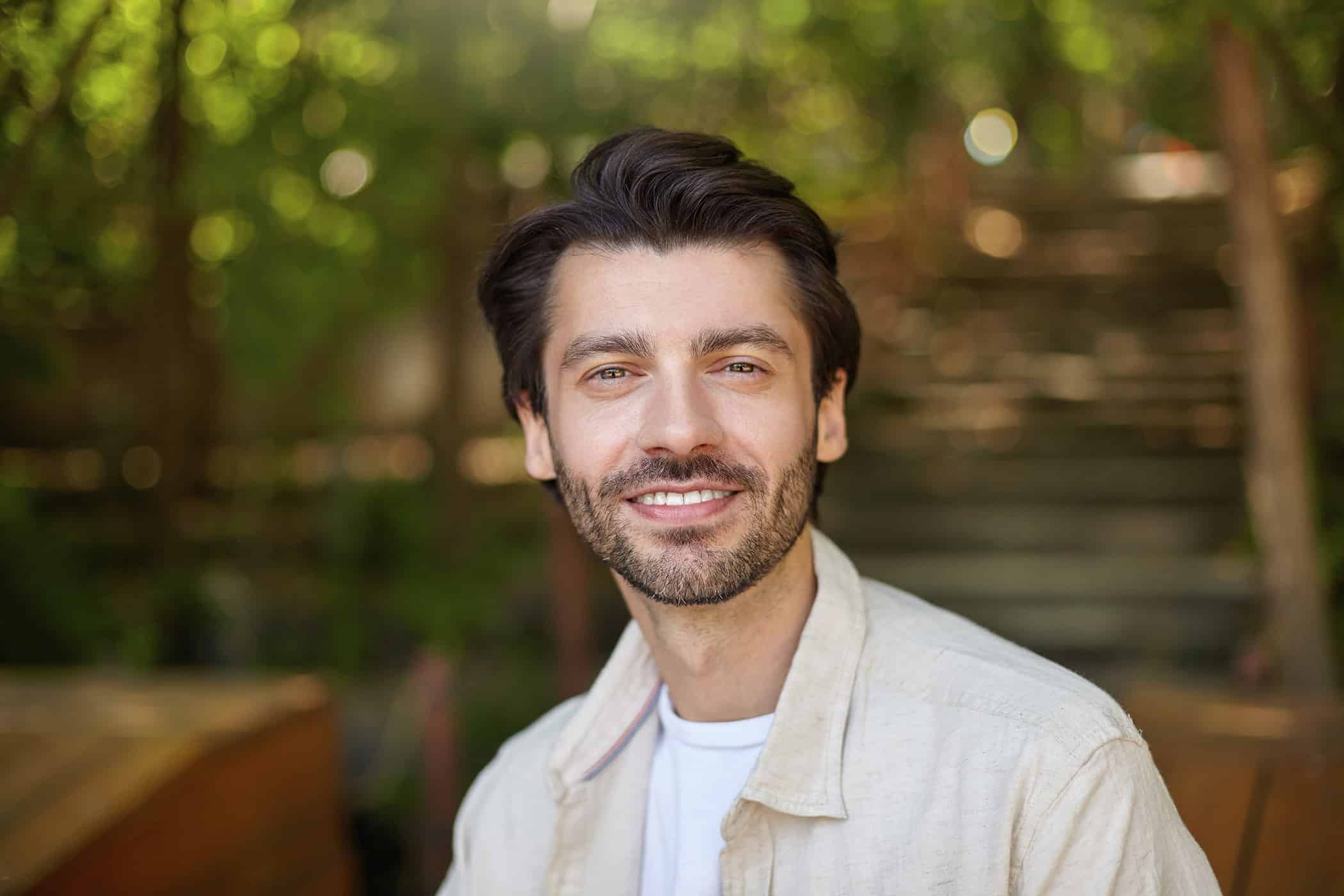 man smiling after cosmetic dentistry at first chair dental
